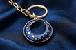 © Jana - Crescent moon keychain with stars on a deep blue fabric background showcasing elegant craftsmanship and intricate detailing