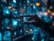 © Darul - Hand touching tech screen data interface bokeh