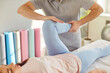 © Studio Romantic - Manual therapy knee, leg injury rehabilitation, male physical therapist doing manipulative therapy in medical clinic room. Female patient lying to get massage to reduce disability, body health, sport