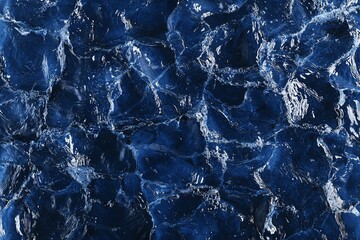 Wall Mural - abstract blue water texture, close-up view of swirling and rippling surface.