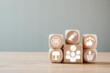 © Satori Studio - Wooden blocks with digital icons illustrating the customer journey, showcasing marketing, shopping, and engagement concepts.
