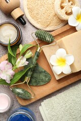 Wall Mural - different body care products, supplies and flowers on grey table, flat lay