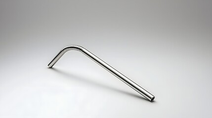 Leinwandbilder - A close up view of a single stainless steel reusable straw with a matte finish elegantly floating on a light gray background  The simple