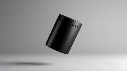 Leinwandbilder - A photo of a matte black seamless cylindrical tea tin elegantly floating on a neutral grey background  The minimalist
