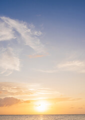 Wall Mural - sunset sky vertical in the morning with blue and orange, yellow sunrise and clouds fluffy, horizon s
