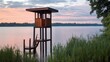 © nabila - Modern Wooden Observation Tower on Serene Lake at Sunset