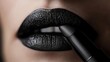 © Julia - In a beauty advertisement, a woman applies dark lipstick, captured in a close-up with a grey background