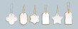 © klyaksun - Gold trimmed gift tags with metallic string of various shapes. Elegant white labels with golden border details. Realistic premium price tags for luxury merchandise or holiday presents packaging.