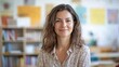 © Daiki - A joyful European female teacher stands in her colorful classroom, embracing a positive learning atmosphere while exuding confidence and warmth.