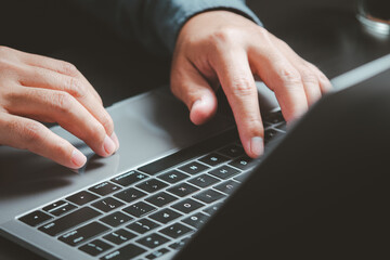 Poster - Technology and Innovation. The close-up of hands on a laptop suggests innovation, coding, or online business activities in a tech-driven world.
