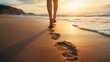 © ORG - A person walking barefoot on a beach, leaving footprints behind Symbolizing leaving the past behind and moving forward.