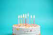 © Ease Enjoy - birthday cake with lit candles on top of it