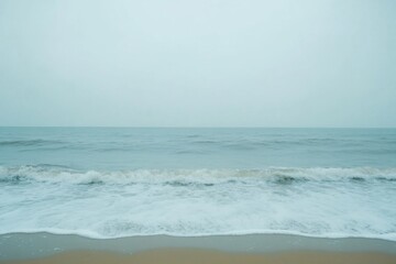 Fototapete - Lonely seashore with gentle waves and overcast sky creating a serene atmosphere for contemplation and relaxation Generative AI