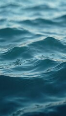Leinwandbilder - Close-up of rippled sea surface. Blue turquoise water reflects daylight. Clean wet liquid nature background with motion, pattern. Summer travel vacation freshness concept with copy space.
