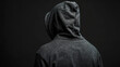 © kichigin19 - Incognito guy in a black hood on a dark background, hides his face