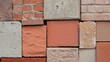 © GATE 22 - Close-up of a wall made up of different types of bricks. the bricks are arranged in a grid-like pattern, with each brick having a different color and texture.