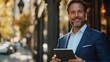 © suphamit - High-energy business leader with a tablet, pointing confidently toward the camera, isolated background