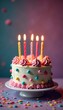 © Pimchada - Festive cake with illuminated birthday candles, decorations, happy