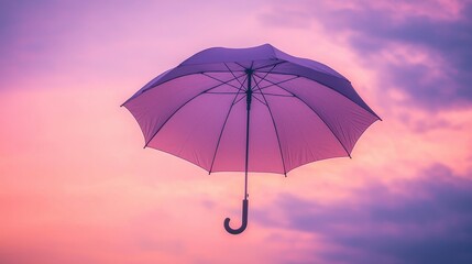 Wall Mural - pastel umbrella suspended in mid air against colorful sky background