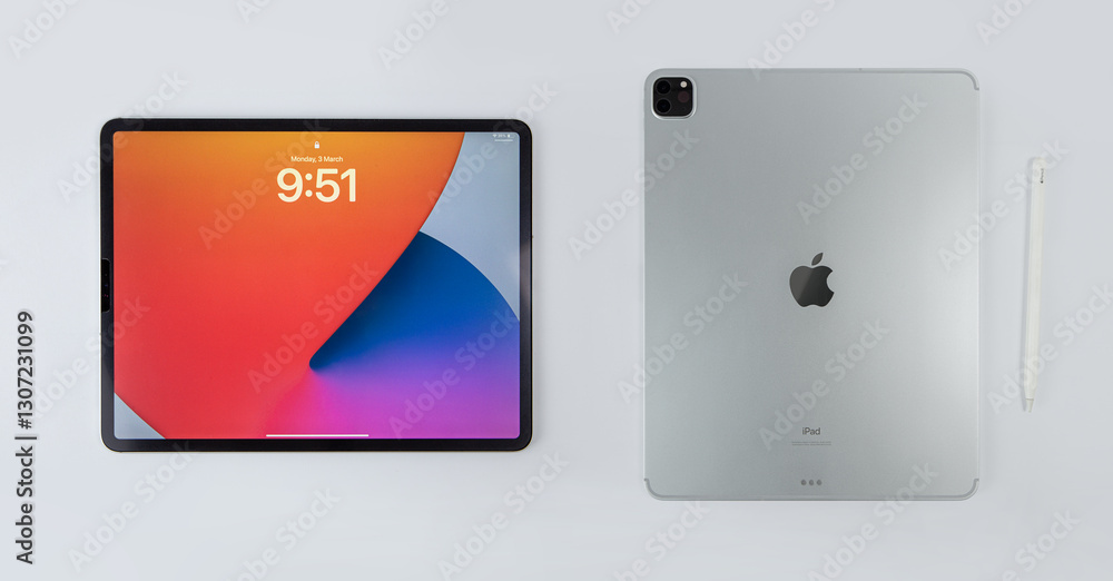 Studio shot of Apple iPad pro and Apple pencil, display home and rear ...