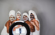 © Sabrina - Multiracial women with facial skin care mask streaming online video for social media followers - Multi generational people doing beauty treatment together