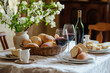© Татьяна Евдокимова - Traditional Italian Easter bread, red wine, and spring flowers create a charming and inviting table setting