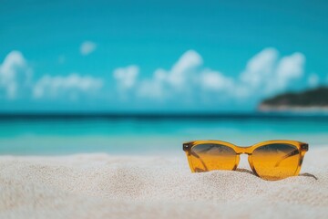 Aufkleber - Sunglasses resting on sandy beach with clear blue ocean and sky in the background during bright sunny day Generative AI