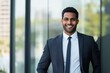 © Abdul Rahim - A confident and charismatic Indian businessman, dressed in sharp formal attire, exudes professionalism and positivity with a warm, engaging smile