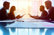 © ЮРИЙ ПОЗДНИКОВ - Business people discussing during a meeting in office boardroom