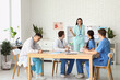 © Pixel-Shot - Female doctor working with her colleagues in clinic