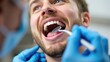 © Marat - Close-up of Man's Smile During Dental Check-up with Dental Mirror