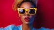 © Vivid_Vision - Trendy young woman with bold yellow sunglasses and red lipstick, fashion portrait