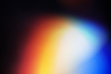 Wall Mural - colorful lens flare on black background.