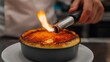 © Gedel - Culinary Artistry: Cr?me br?l?e torching perfection
