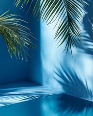 Wall Mural - tropical palm leaves cast shadows on a vibrant blue background, creating a summery, minimalist scene