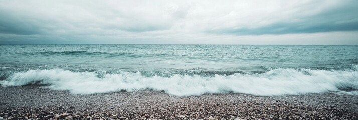 Fototapete - Lonely seashore with gentle waves under an overcast sky and open space for text Generative AI