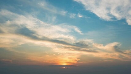 Wall Mural - sky transform from the first light of dawn to a radiant sunrise, with beautiful clouds painting the 