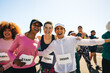 © Jacob Lund - Diverse group of happy runners celebrating on race day