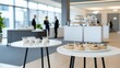 © BirD - Modern conference setup with refreshments and snacks for networking event.