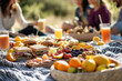 © Riva - A classic picnic with friends, featuring a vibrant spread of sandwiches, fruits, and cold drinks on a large blanket in a scenic outdoor spot