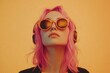© Alexei - A woman with pink hair is wearing trendy headphones and sunglasses