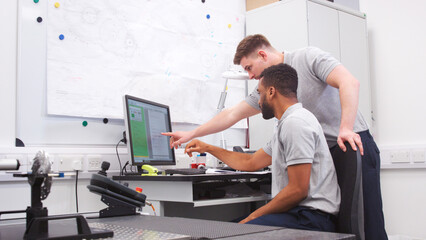 Wall Mural - two male engineers uses cmm coordinate measuring machine in factory