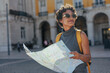 © bernardbodo - Tourist exploring lisbon with map and backpack enjoying summer vacations