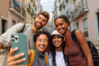 © bernardbodo - Happy tourists taking a photo of themselves in lisbon, portugal