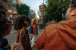 © bernardbodo - Group of young tourists walking down the street and smiling