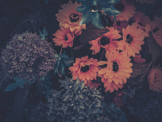 Wall Mural - vibrant artificial flowers in full bloom, showcasing a variety of colors and textures in a decorativ