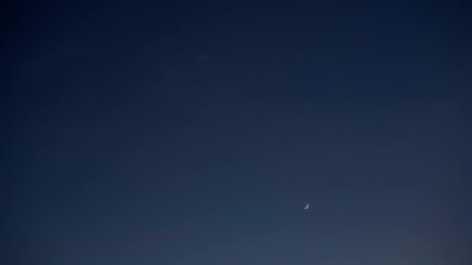 Wall Mural - crescent young moon with stars, planets and countryside silhouettes.