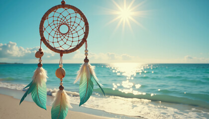 a dreamcatcher with feathers and beads hangs over a serene beach with sparkling ocean waves under a 