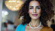 © Chari - Beautiful woman with curly hair poses confidently indoors with elegant decor and soft lighting