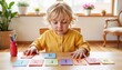 © Lena - Curious blonde child learning letters with educational flashcards at home